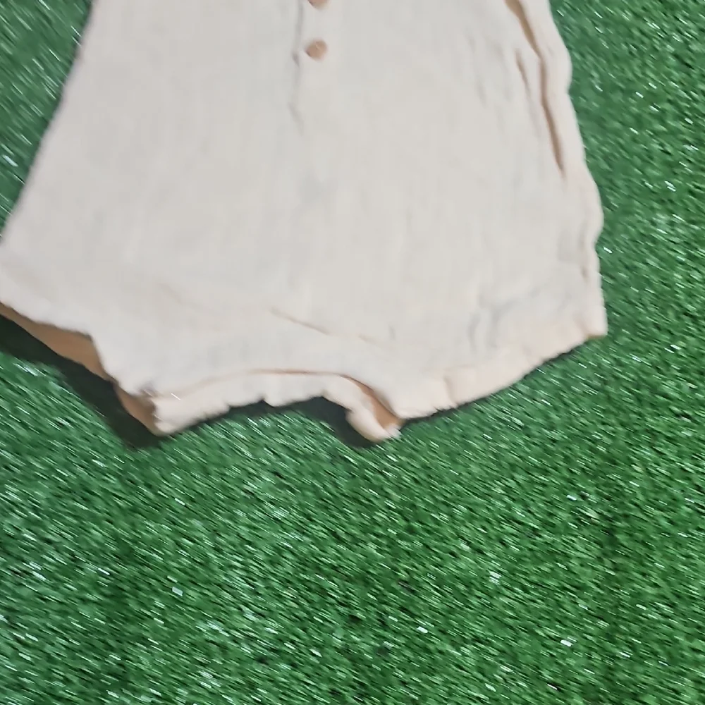 Cream Sleeveless Baby Romper